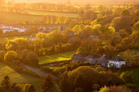 Brentor village bathed in golden light