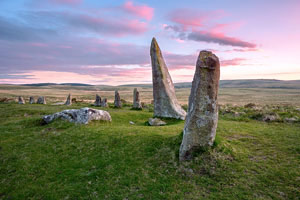 Beautiful pink clouds after sunset over Scorhill Stone Circle, Dartmoor